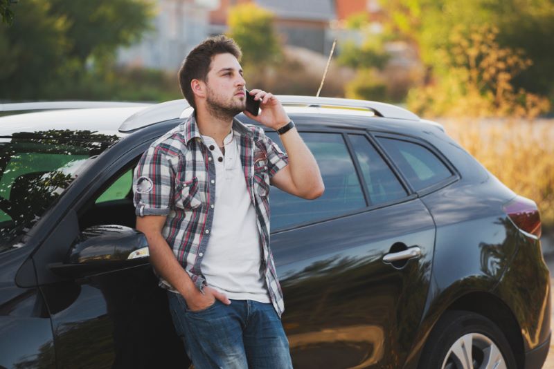 man on the phone after a car accident