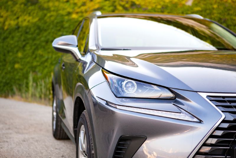 closeup of a grey sedan parked on a driveway