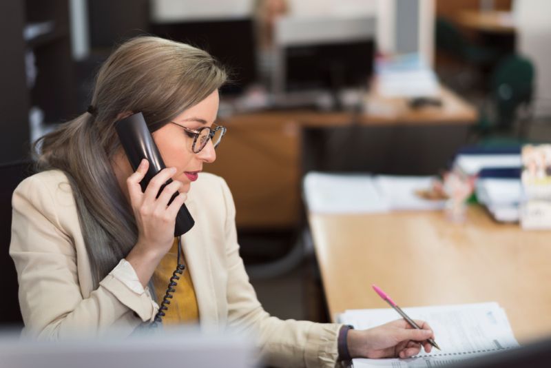 Female insurance agent on a phone call at work